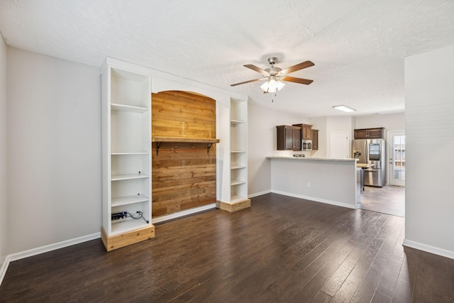 2306 New Holland Cir, Murfreesboro, TN 37128 - unfurnished living room featuring ceiling fan, dark wood finished floors, a textured ceiling, and built in shelves