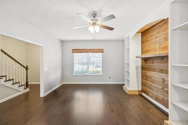 2306 New Holland Cir, Murfreesboro, TN 37128 - unfurnished living room with a ceiling fan, wood finished floors, stairs, and a textured ceiling