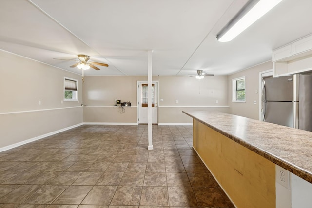 3337 Hartsville Rd, Lafayette, TN 37083 - kitchen featuring freestanding refrigerator, ceiling fan, french doors, and white cabinetry