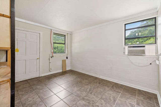 3337 Hartsville Rd, Lafayette, TN 37083 - unfurnished room featuring cooling unit, concrete block wall, and ornamental molding