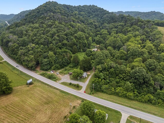 3337 Hartsville Rd, Lafayette, TN 37083 - aerial view of a heavily wooded area and a mountainous background