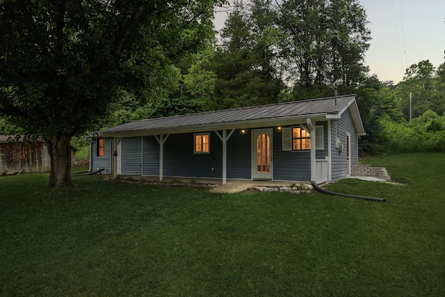3337 Hartsville Rd, Lafayette, TN 37083 - ranch-style home featuring a front yard, a metal roof, a standing seam roof, and a porch
