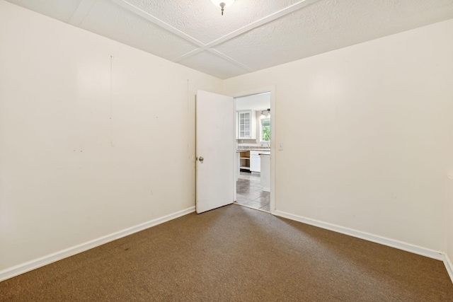 3337 Hartsville Rd, Lafayette, TN 37083 - carpeted spare room with baseboards and a textured ceiling
