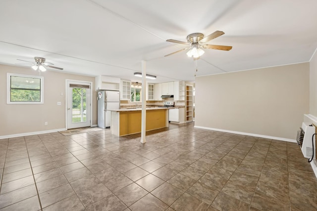 3337 Hartsville Rd, Lafayette, TN 37083 - kitchen featuring open floor plan, ceiling fan, and freestanding refrigerator