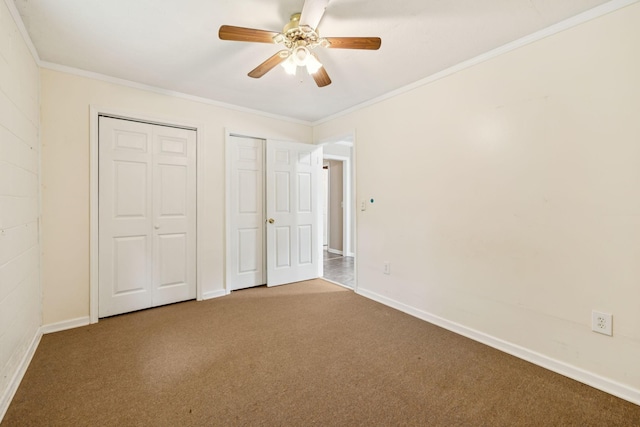 3337 Hartsville Rd, Lafayette, TN 37083 - unfurnished bedroom featuring carpet floors, multiple closets, ornamental molding, and a ceiling fan