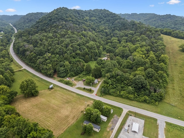 3337 Hartsville Rd, Lafayette, TN 37083 - aerial view of a heavily wooded area and a mountain backdrop