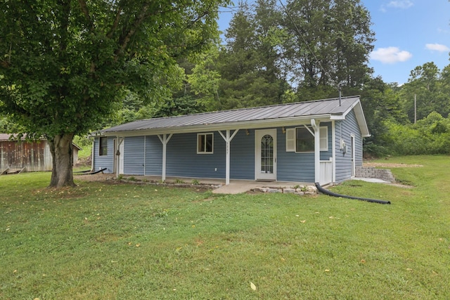 3337 Hartsville Rd, Lafayette, TN 37083 - view of front facade with a front lawn and a metal roof