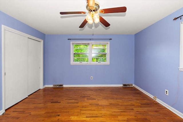 318 David St, Lawrenceburg, TN 38464 - unfurnished bedroom with wood finished floors, a closet, and a ceiling fan
