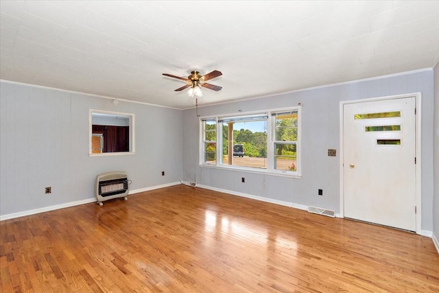 318 David St, Lawrenceburg, TN 38464 - unfurnished living room with heating unit, light wood finished floors, a ceiling fan, and ornamental molding