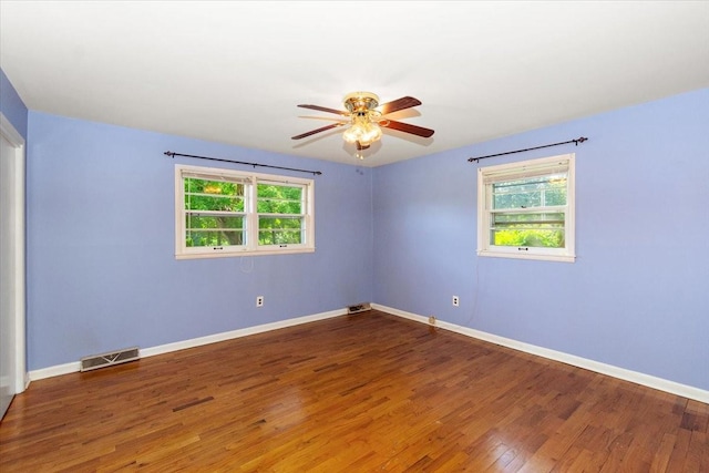 318 David St, Lawrenceburg, TN 38464 - unfurnished room featuring plenty of natural light, wood finished floors, and ceiling fan