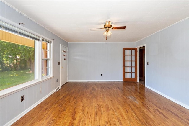 318 David St, Lawrenceburg, TN 38464 - spare room with crown molding, light wood-style flooring, and a ceiling fan