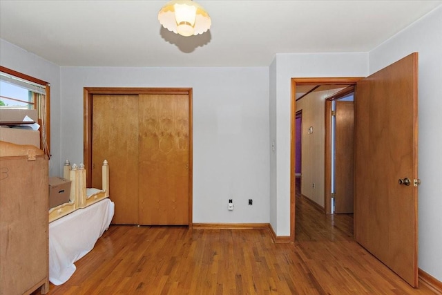 318 David St, Lawrenceburg, TN 38464 - unfurnished bedroom featuring wood finished floors and a closet