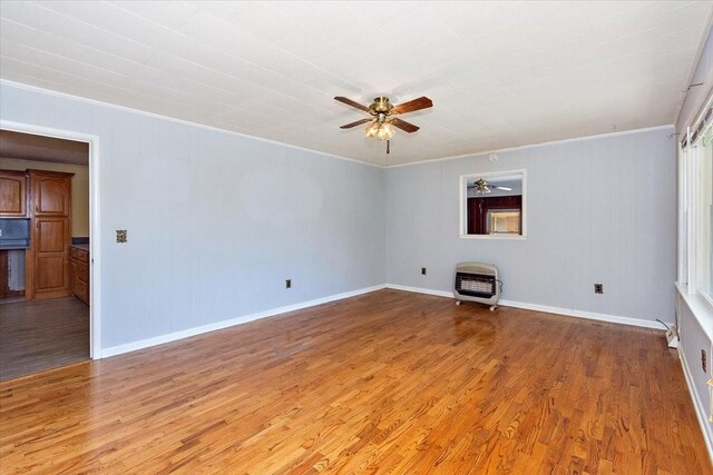 318 David St, Lawrenceburg, TN 38464 - spare room with heating unit, a ceiling fan, wood finished floors, and crown molding