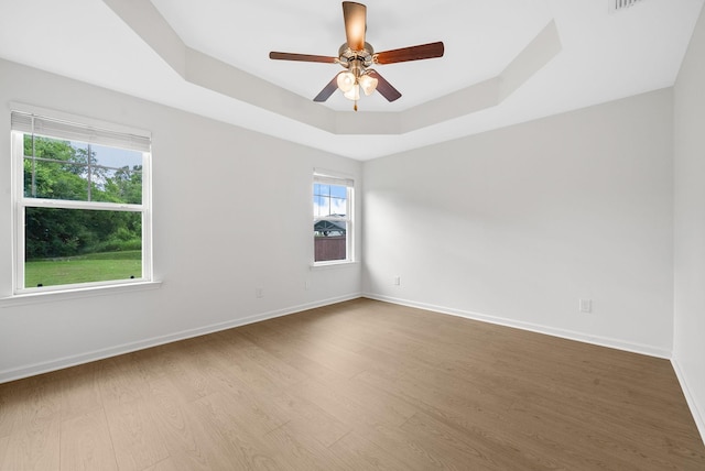 2149 Longhunter Chase Dr, Spring Hill, TN 37174 - unfurnished room with wood finished floors, a raised ceiling, and ceiling fan
