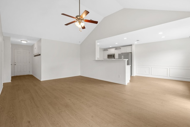 2149 Longhunter Chase Dr, Spring Hill, TN 37174 - unfurnished living room with a ceiling fan, light wood-style floors, high vaulted ceiling, and recessed lighting