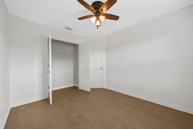 2149 Longhunter Chase Dr, Spring Hill, TN 37174 - unfurnished bedroom featuring wood finished floors, a closet, and ceiling fan