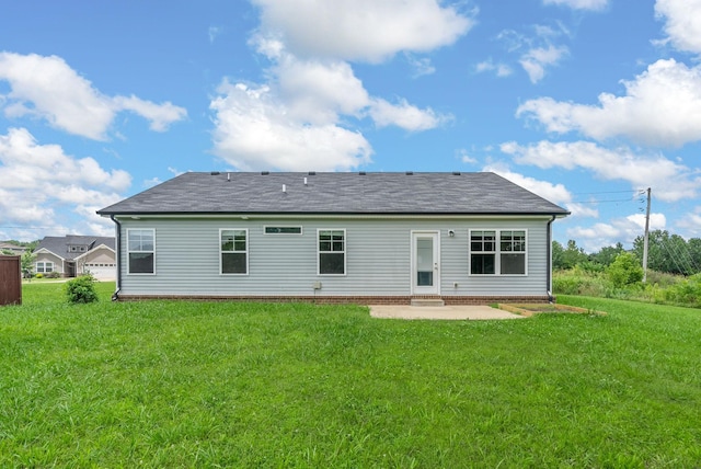 2149 Longhunter Chase Dr, Spring Hill, TN 37174 - rear view of property with a patio, a lawn, and roof with shingles