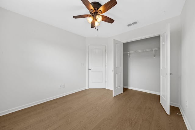 2149 Longhunter Chase Dr, Spring Hill, TN 37174 - unfurnished bedroom featuring wood finished floors, a closet, and ceiling fan