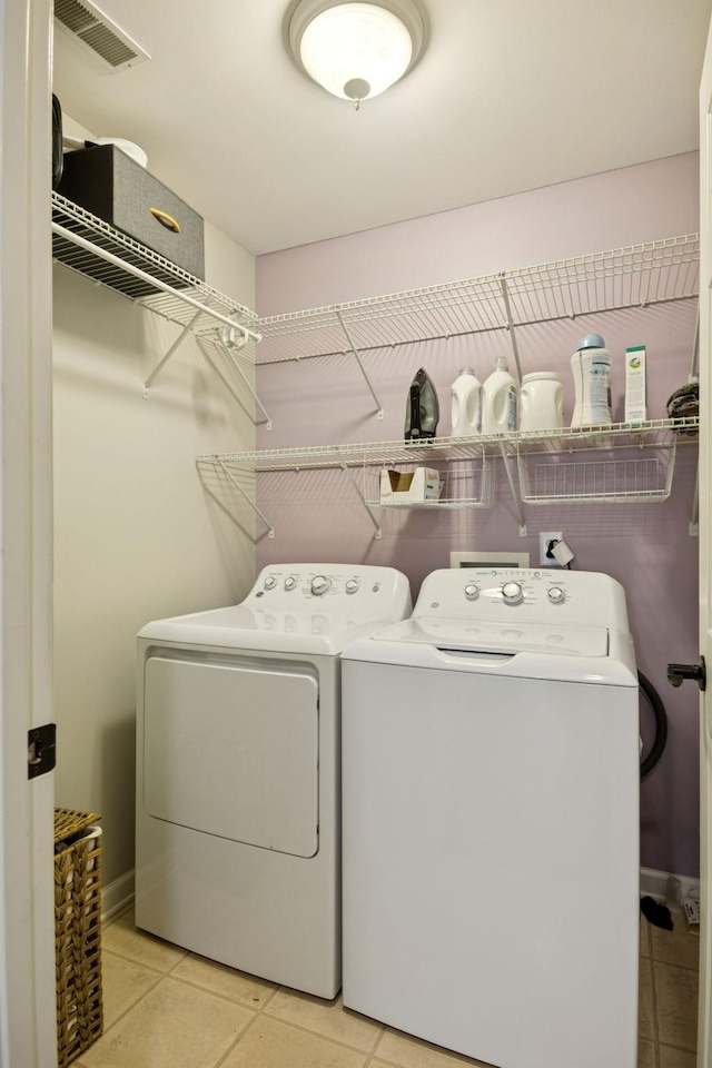 808 Garrett Way Ct, Antioch, TN 37013 - laundry area with washer and clothes dryer and tile patterned floors