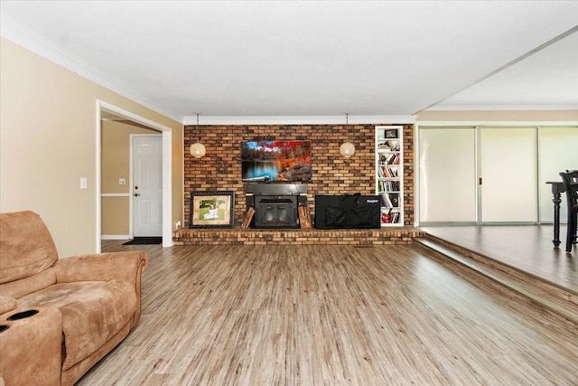 19 Horseshoe Bend Rd, Leoma, TN 38468 - unfurnished living room with wood finished floors, a brick fireplace, and ornamental molding