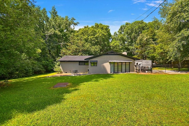 19 Horseshoe Bend Rd, Leoma, TN 38468 - rear view of house with a patio area and a metal roof
