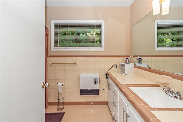 19 Horseshoe Bend Rd, Leoma, TN 38468 - full bath with healthy amount of natural light, vanity, tile walls, tile patterned floors, and a wainscoted wall