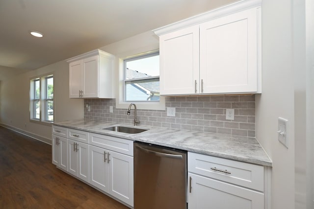 1142 Snow Ave, Madison, TN 37115 - kitchen featuring stainless steel dishwasher, white cabinetry, dark wood-style floors, tasteful backsplash, and light stone counters