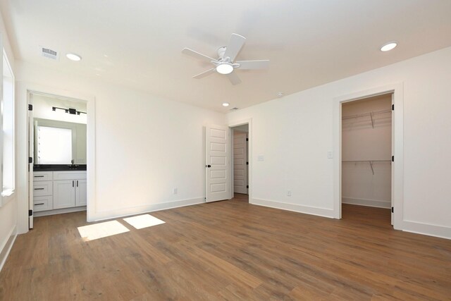 1142 Snow Ave, Madison, TN 37115 - unfurnished bedroom featuring wood finished floors, recessed lighting, a walk in closet, ensuite bath, and a ceiling fan