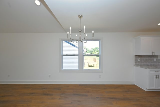 1142 Snow Ave, Madison, TN 37115 - unfurnished dining area featuring a chandelier and dark wood-style floors