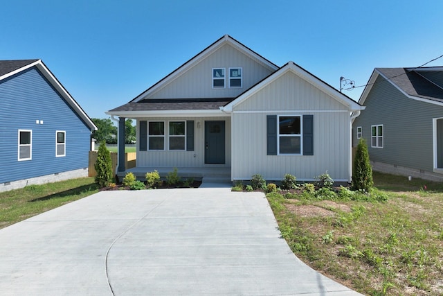 1142 Snow Ave, Madison, TN 37115 - view of front of home featuring a porch, roof with shingles, and board and batten siding