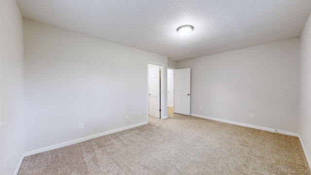 4321 Lynchburg Rd, Winchester, TN 37398 - empty room featuring carpet floors and a textured ceiling