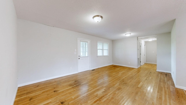 4321 Lynchburg Rd, Winchester, TN 37398 - spare room with light wood finished floors and a textured ceiling
