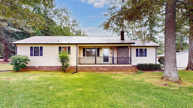 4321 Lynchburg Rd, Winchester, TN 37398 - ranch-style home with a front lawn, a chimney, covered porch, and a metal roof