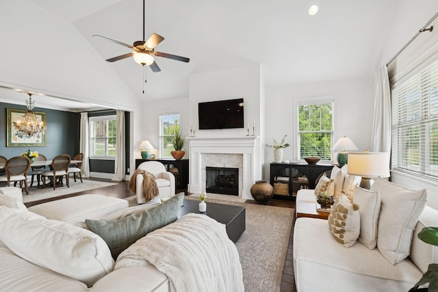 923 Hornsby Dr, Franklin, TN 37064 - living area with a chandelier, a fireplace with flush hearth, wood finished floors, ceiling fan, and high vaulted ceiling