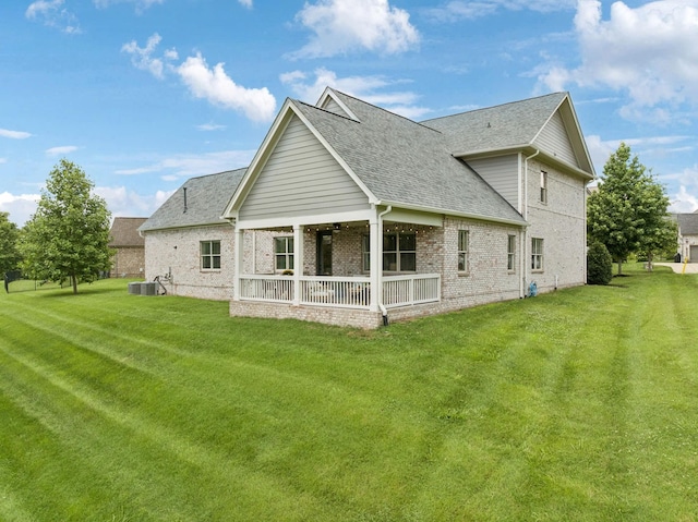 923 Hornsby Dr, Franklin, TN 37064 - rear view of house with a shingled roof, a yard, brick siding, and a ceiling fan
