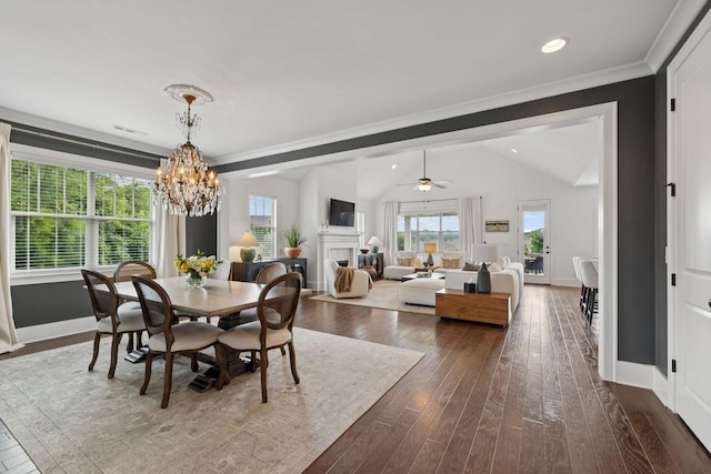 923 Hornsby Dr, Franklin, TN 37064 - dining space featuring dark wood-style flooring, vaulted ceiling, a chandelier, ornamental molding, and a ceiling fan