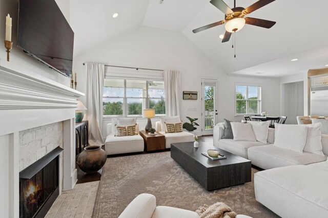 923 Hornsby Dr, Franklin, TN 37064 - living area with a stone fireplace, a ceiling fan, recessed lighting, light wood-type flooring, and high vaulted ceiling