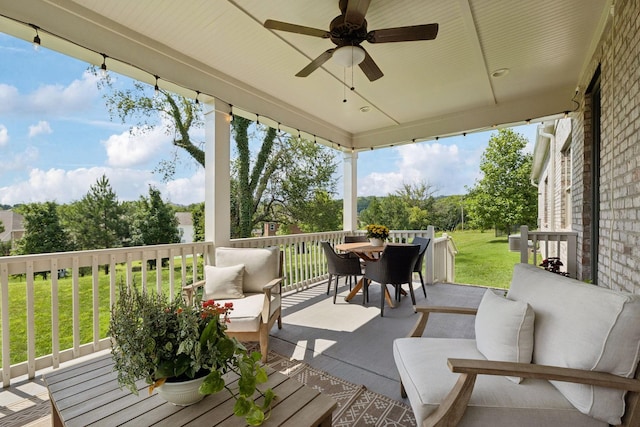 923 Hornsby Dr, Franklin, TN 37064 - wooden terrace with outdoor dining area, an outdoor living space, a ceiling fan, and a lawn