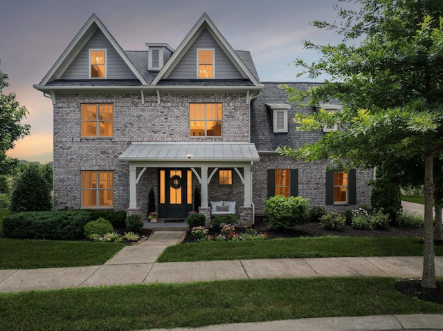 923 Hornsby Dr, Franklin, TN 37064 - view of front of house with brick siding, a lawn, and covered porch