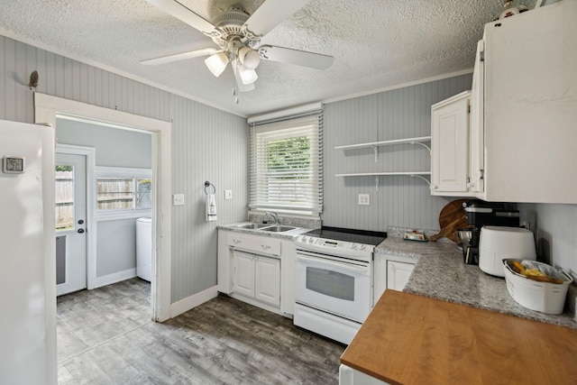 410 England St E, Cowan, TN 37318 - kitchen with white appliances, crown molding, ceiling fan, wood finished floors, and white cabinets