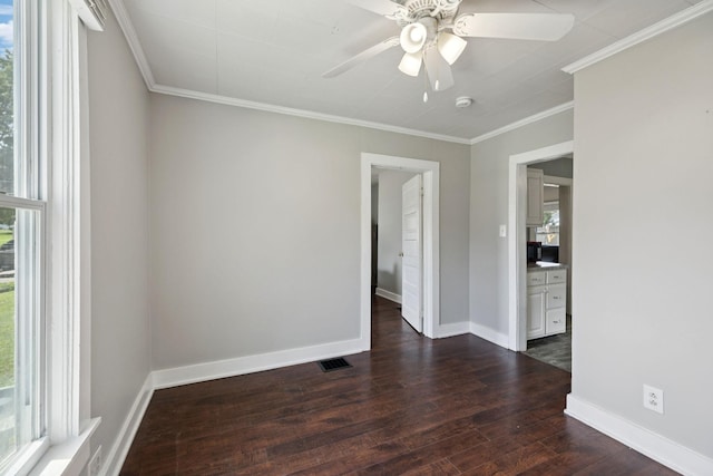 410 England St E, Cowan, TN 37318 - spare room featuring plenty of natural light, dark wood-type flooring, a ceiling fan, and crown molding