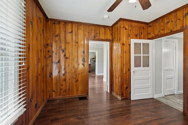 410 England St E, Cowan, TN 37318 - spare room featuring wooden walls, a ceiling fan, a smoke detector, and dark wood-style flooring