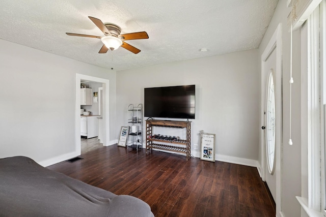 410 England St E, Cowan, TN 37318 - living area featuring wood finished floors, a ceiling fan, and a textured ceiling