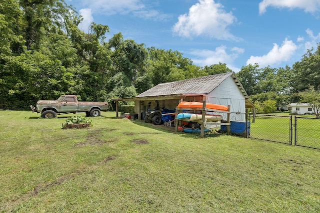 410 England St E, Cowan, TN 37318 - view of yard featuring an outbuilding, a gate, and an outdoor structure