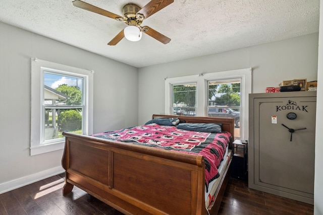 410 England St E, Cowan, TN 37318 - bedroom featuring multiple windows, dark wood-style flooring, a textured ceiling, and ceiling fan