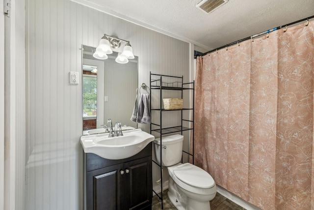 410 England St E, Cowan, TN 37318 - bathroom with vanity, a textured ceiling, and a shower with shower curtain