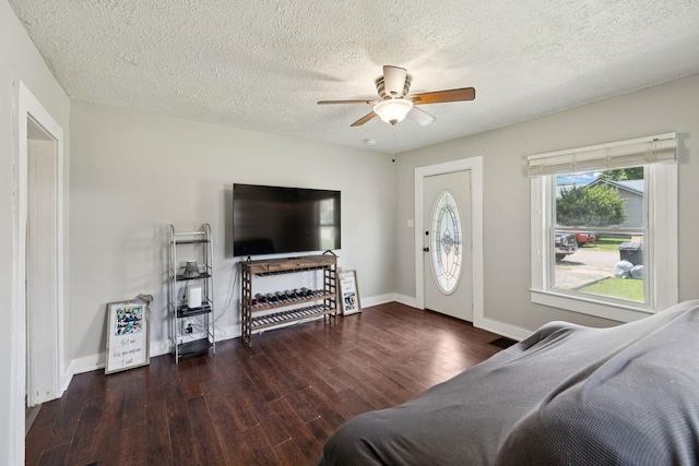410 England St E, Cowan, TN 37318 - bedroom featuring wood finished floors, a textured ceiling, and a ceiling fan