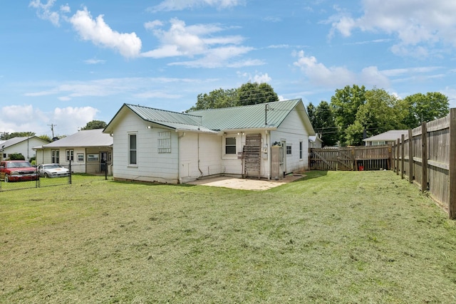 410 England St E, Cowan, TN 37318 - back of house with a fenced backyard, a patio, and a metal roof