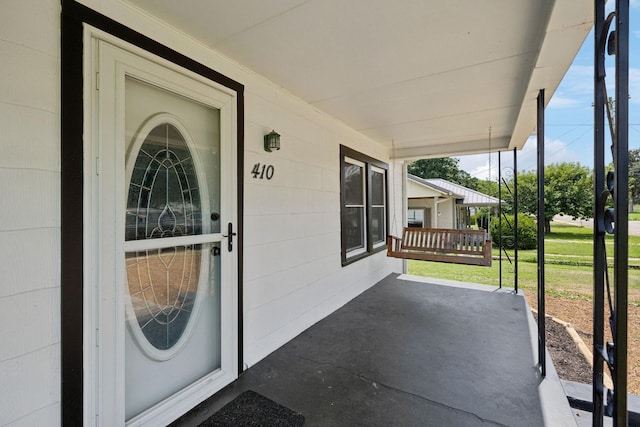 410 England St E, Cowan, TN 37318 - property entrance featuring covered porch and a yard