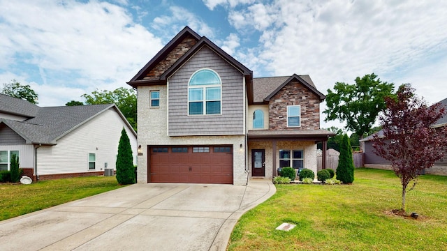 1197 Ewing Way, Clarksville, TN 37043 - craftsman inspired home featuring driveway, a front lawn, an attached garage, and stone siding